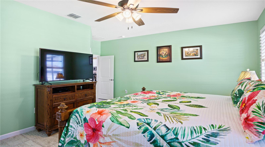 Primary bedroom located in the rear of the home