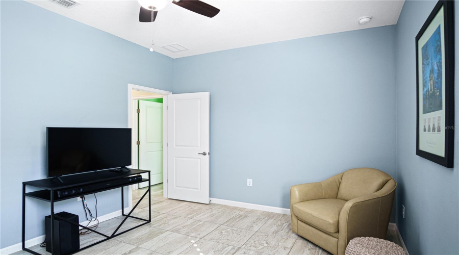 Bedroom 2 located in the center of the home