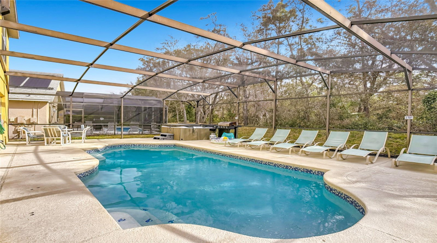Spacious pool deck with plenty of space for soaking uo the sun