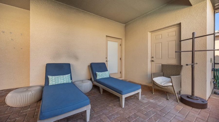 Covered porch/lanai by the pool