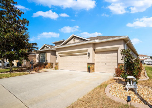 Exterior Front, wide 3 car driveway.