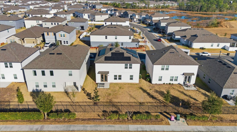 Aerial view of the property and the community