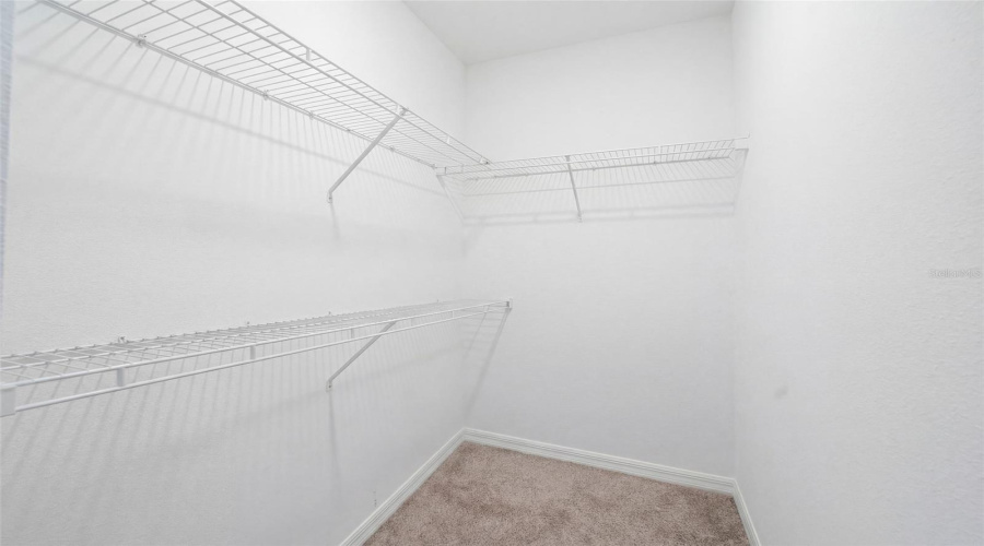 Walk-in closet in primary bedroom 2