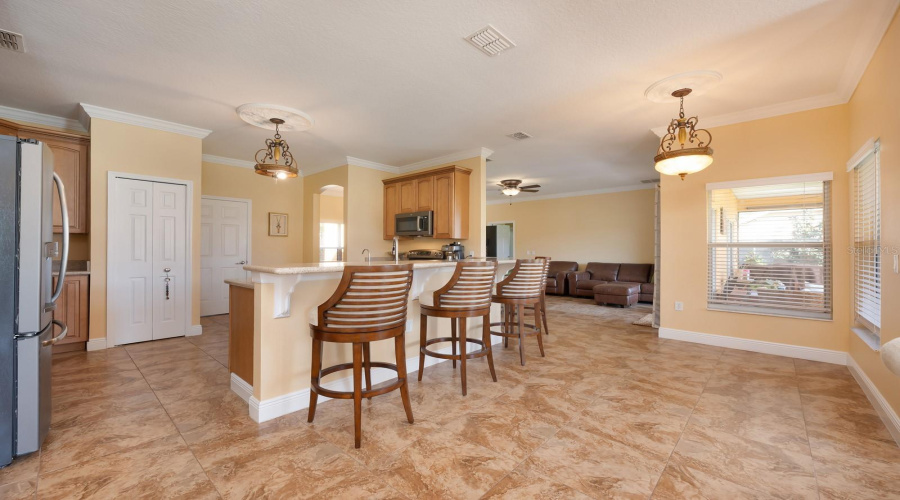 Family room is open to a modern kitchen and bright breakfast nook.