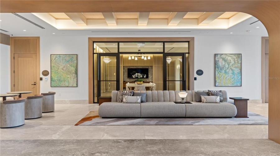 Florian Park Amenities: A Welcomed Arrival. The stage is set for your much-anticipated entrance. A porte-cochere will lead to the open-air lobby, staffed 24/7, so there’s always someone to welcome you home. You’ll delight in the instantly impressive space which features your Residential Services reception area, the resident’s lounge, inspired workspaces, flex rooms for events and a coffee bar.