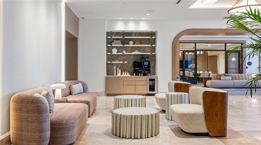 Florian Park Amenities: A Welcomed Arrival. The stage is set for your much-anticipated entrance. A porte-cochere will lead to the open-air lobby, staffed 24/7, so there’s always someone to welcome you home. You’ll delight in the instantly impressive space which features your Residential Services reception area, the resident’s lounge, inspired workspaces, flex rooms for events and a coffee bar.