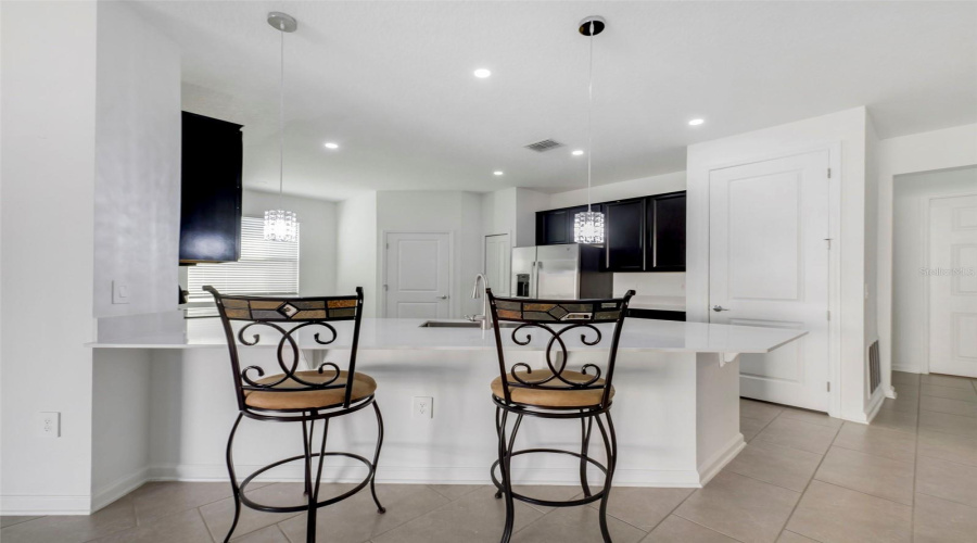 The kitchen is open to the living and dining areas.