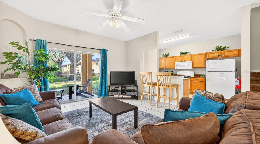 Sliding glass doors open to the covered lanai and let natural light pour through the space.