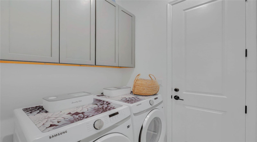 Laundry room. Conveniently connected to master bedroom's closet.