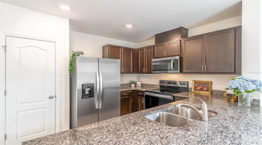 Kitchen with storage pantry