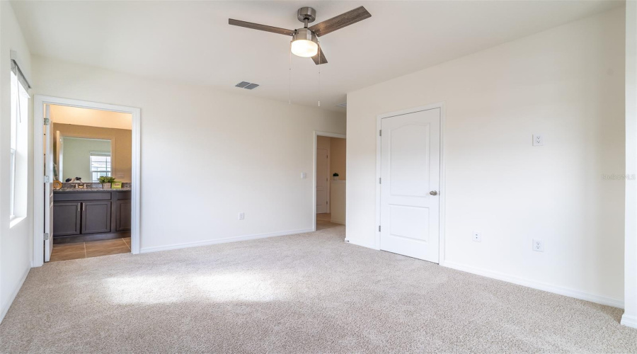 Walk-in closet in primary bedroom