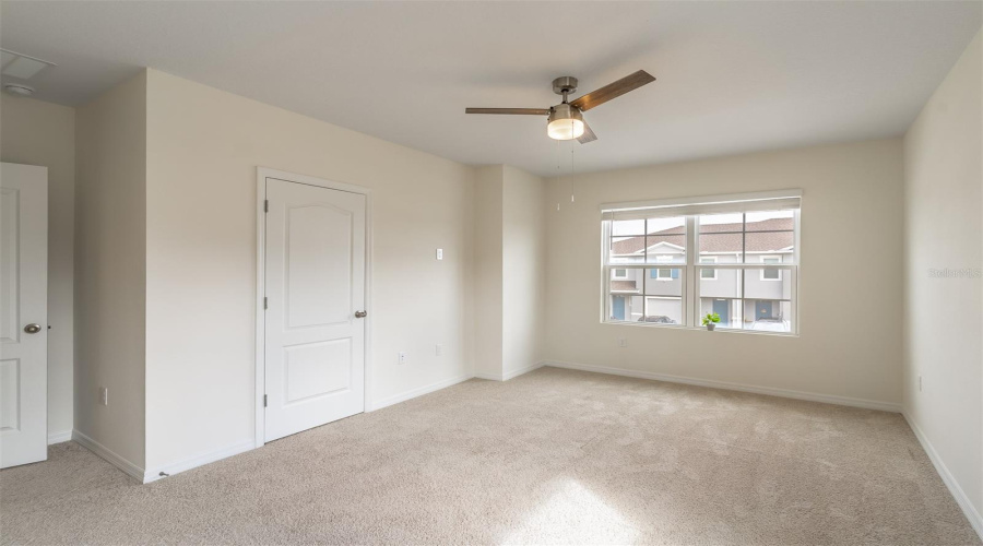 Primary bedroom filled with natural light