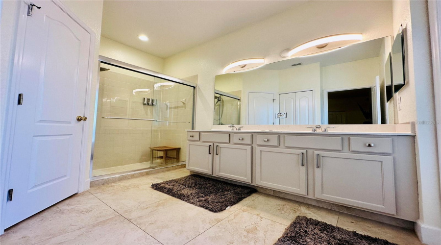 Master Bathroom with dual sinks and walk in shower