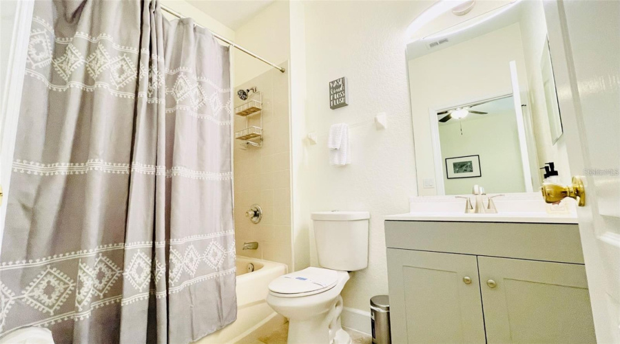 2nd Master Bathroom with shower/tub combo and single vanity