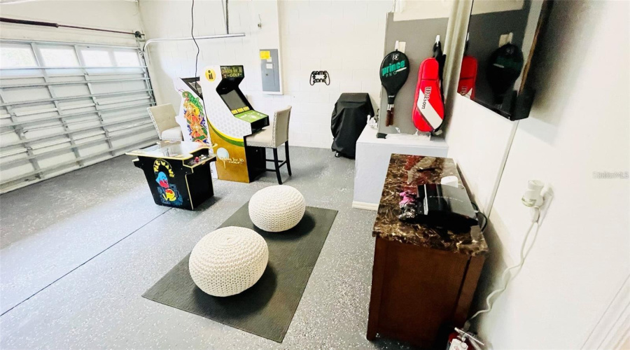 Games Room with Epoxy Floor, Three Aracade Machines, Playstation and Flat Screen TV