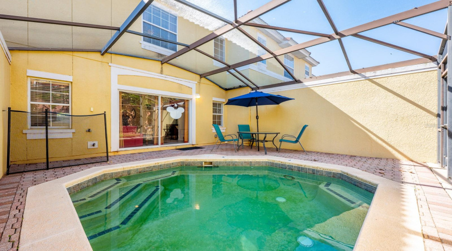 Step outside to the paver patio and your PRIVATE HEATED PLUNGE POOL, all enclosed within a screened lanai, offering a peaceful and private setting—perfect for unwinding after a day at the parks or hosting guests.