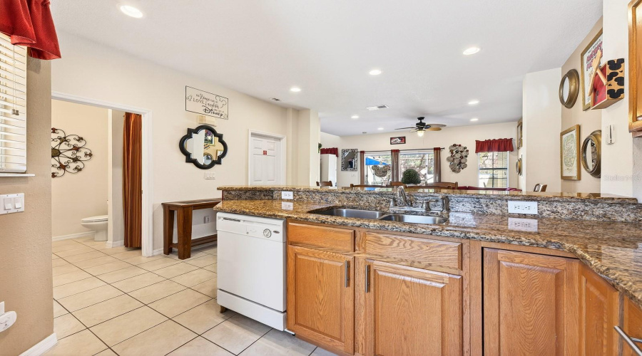 With room for counter-height stools, the Kitchen island doubles as a comfortable spot for quick meals or gathering with guests.