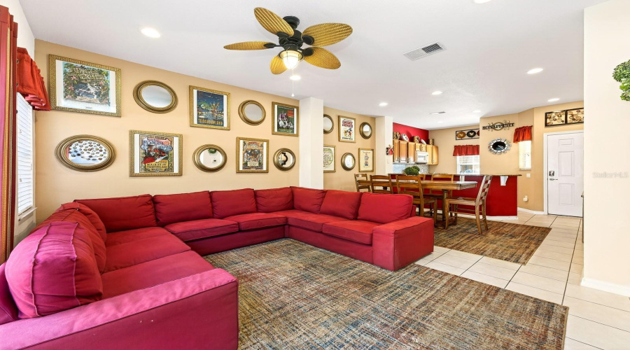 The generous Dining area and Living Room are filled with NATURAL LIGHT, thanks to sliding glass doors that lead to your own PRIVATE OUTDOOR RETREAT.