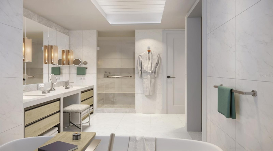 Artist Rendering. Luxurious primary bath featuring custom vanities, marble floors, walls and shower and lavish freestanding soaking tub.