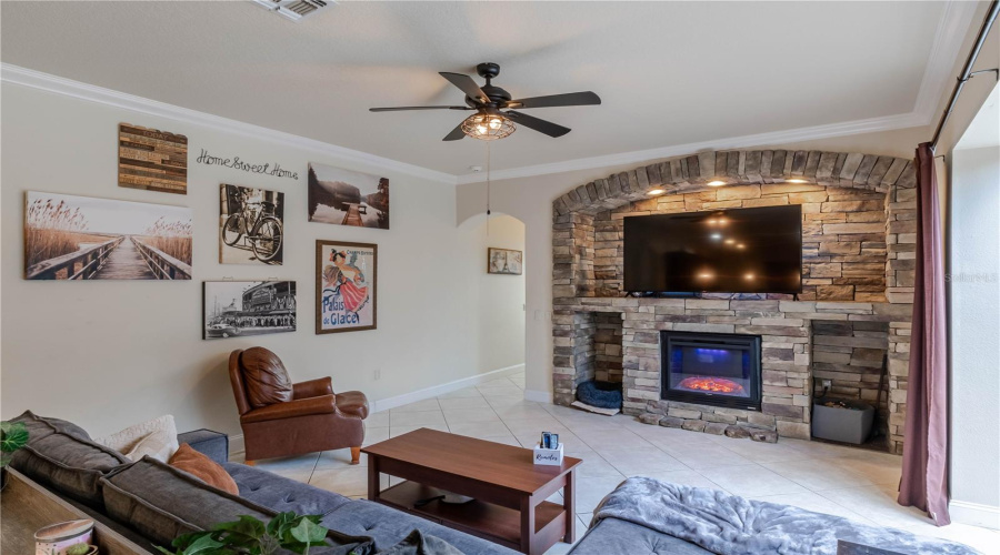 Gorgeous stone feature for TV and electric fireplace. The nooks are great for small pet beds!