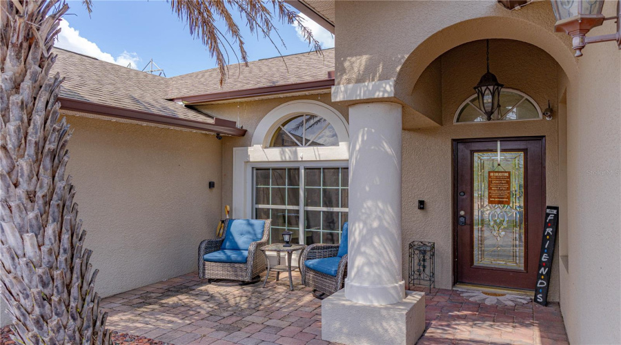 Front entryway with brick paver porch