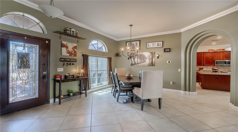 Front entryway into a formal dining and living space