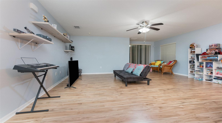 Open and spacious Living room with neutral toned laminate flooring. No carpet!