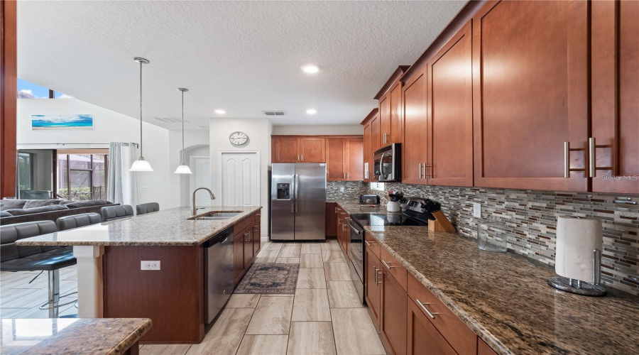 Kitchen with granite countertops and stainless steel applicances