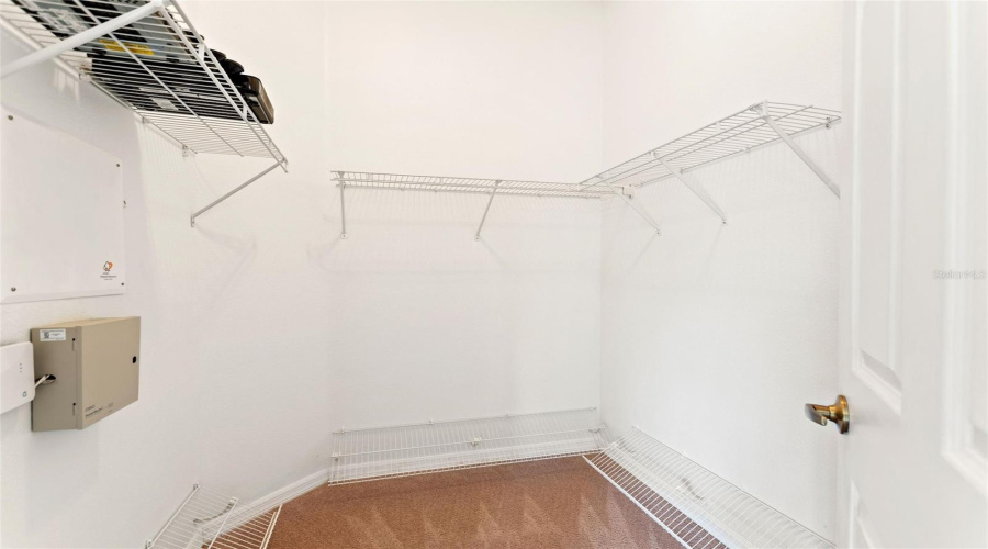 Walk in closet in primary bedroom