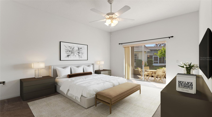 Virtually staged primary en suite bedroom & lanai