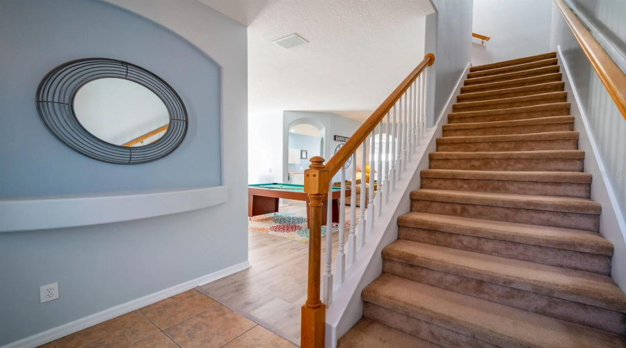 Stairs to loft and three upstairs bedrooms