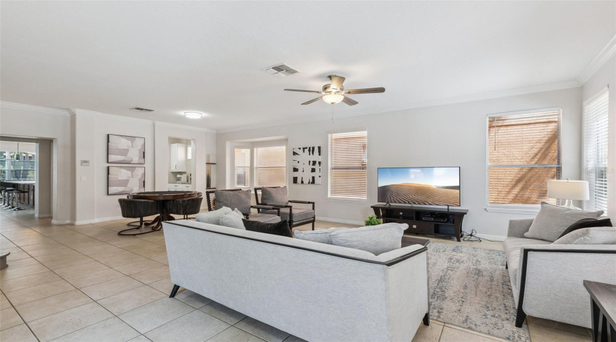 Font living room with poker and bumper-pool table, tv and entertainment space