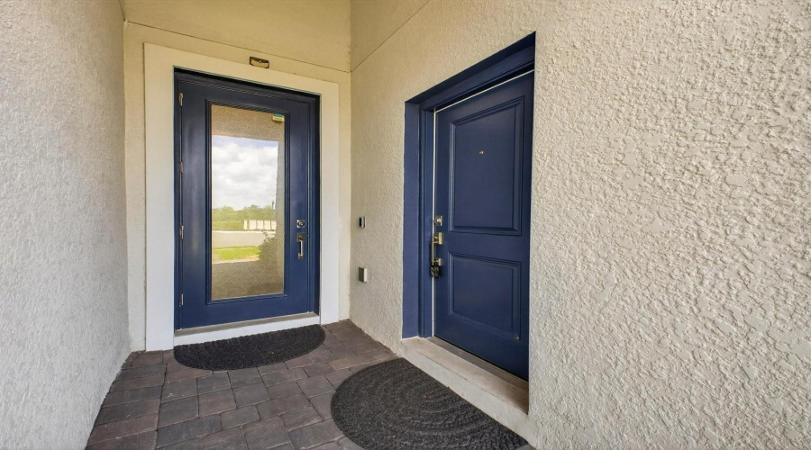 Glass entry door to the main home