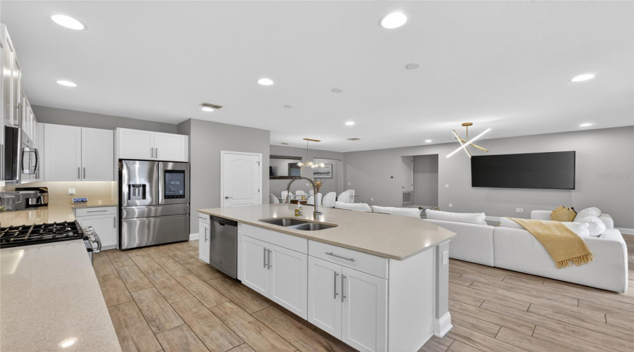 Kitchen Features Include Solid Surface Counters and Stainless Steel Appliances