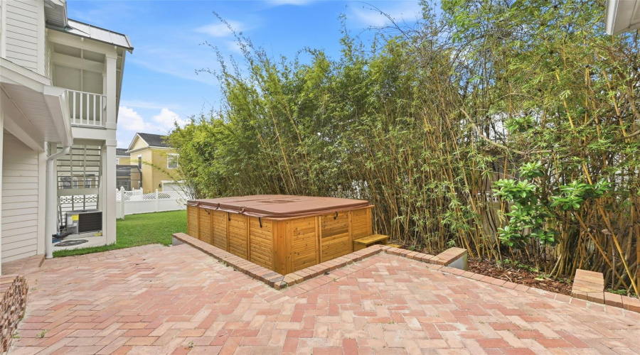 Fenced in yard with swim spa