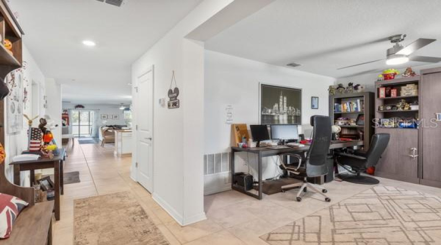 View from front door showing flex space and into living area