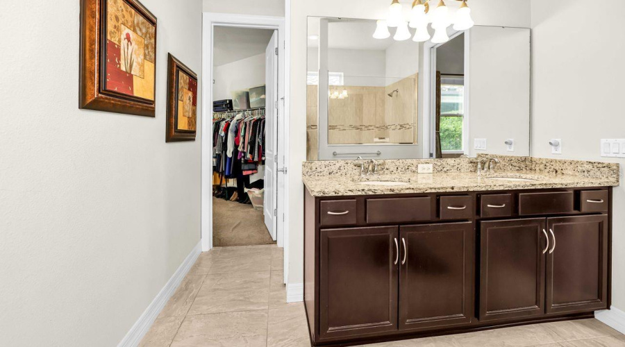 Master bath leading to large walk in closet