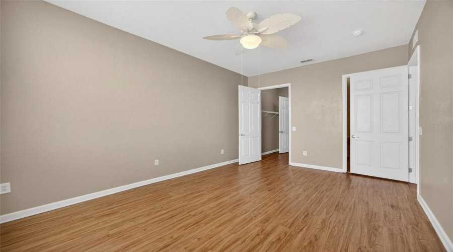 Primary bath behind the door and closet