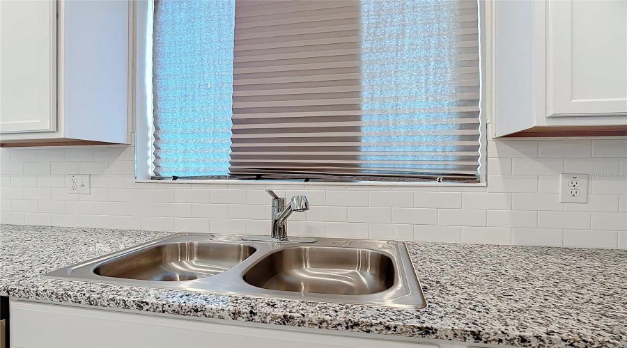 Kitchen sink overlooking outside