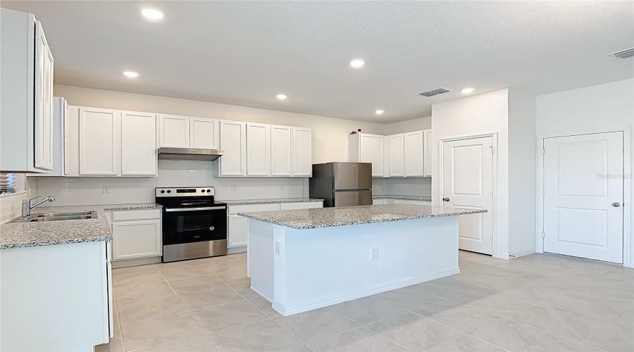 Large Kitchen Island and breakfast area