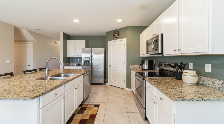 Modern open kitchen with granite countertops