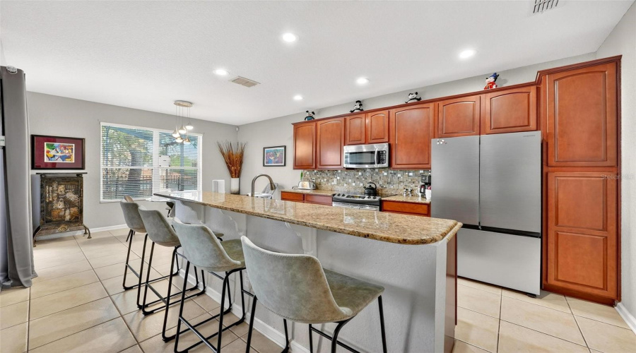From_familydining_room_looking_at_kitchen_and_double_windows_is_the_breakfast_nook