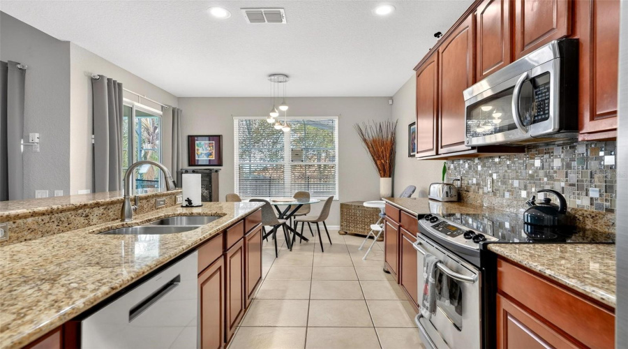 Kitchen_and_breakfast_nook_by_double_window