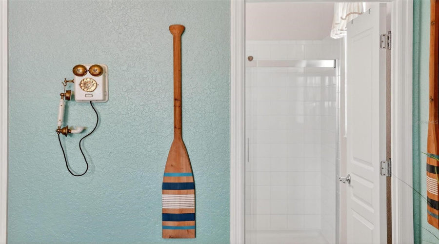 Primary_bathroom_door_with_updated_shower_enclosure