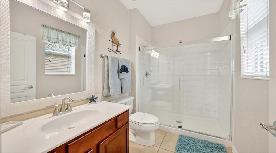 2nd_bedroom_en-suite_bathroom_pic_#2_showing_shower_with_updated_glass_enclosure