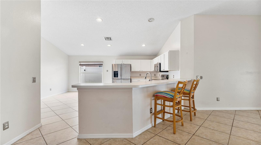 Breakfast bar in addition to an eating area in the kitchen
