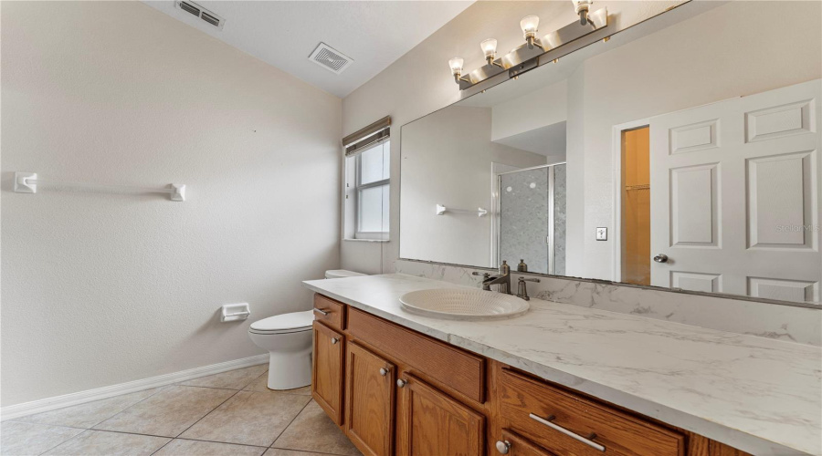 Primary bathroom with tons of storage space under the sink