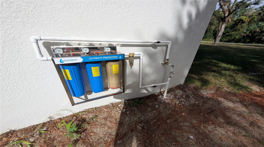 WATER FILTERS ON LEFT SIDE OF HOUSE