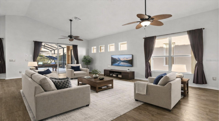 Virtually Stagged Large living area with lots of natural lighting