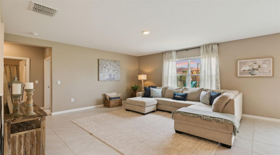 Tile flooring can be found throughout the downstairs main living areas
